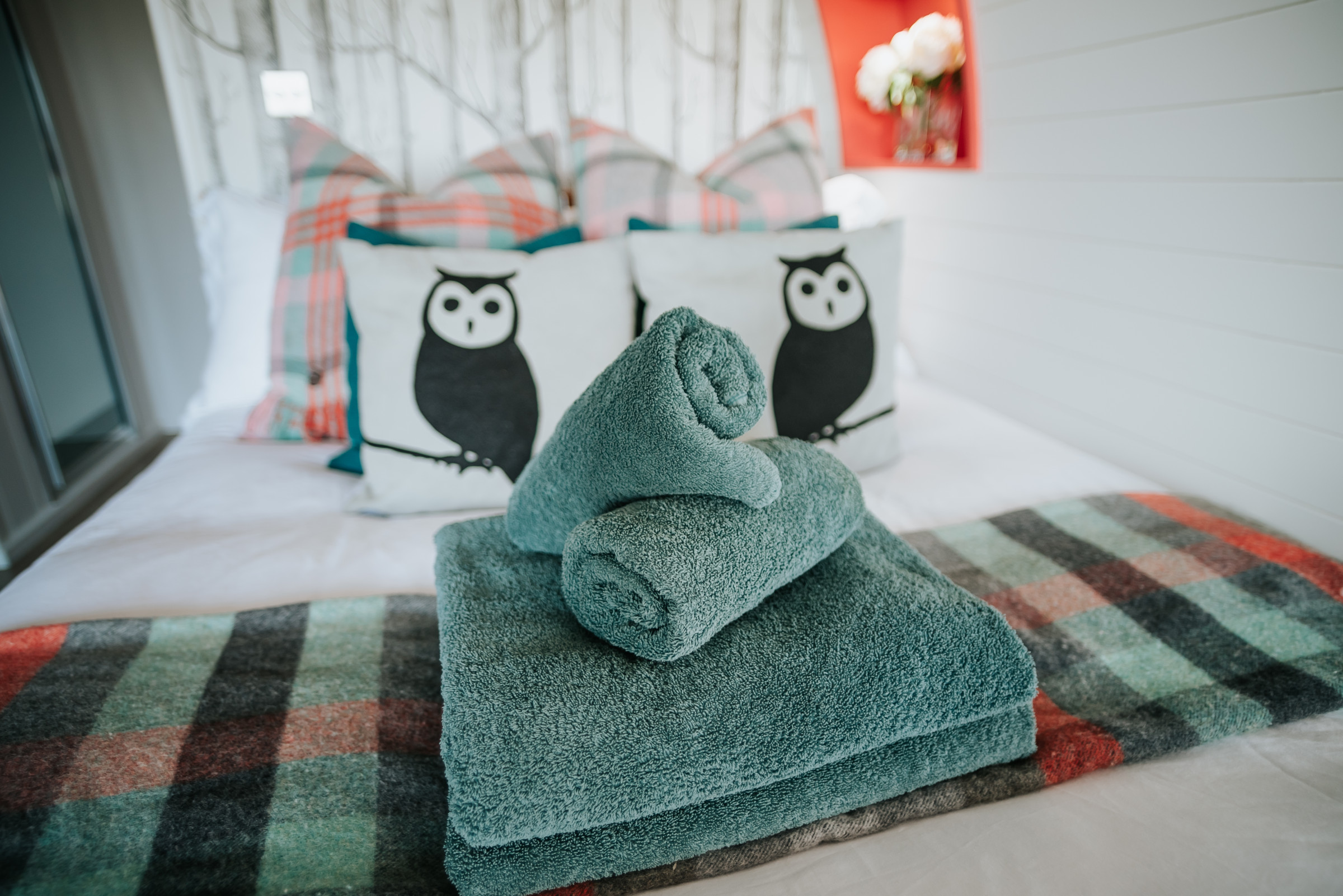 Bed inside the luxury pod at Catgill Farm, surrounded by warm lighting and natural decor.